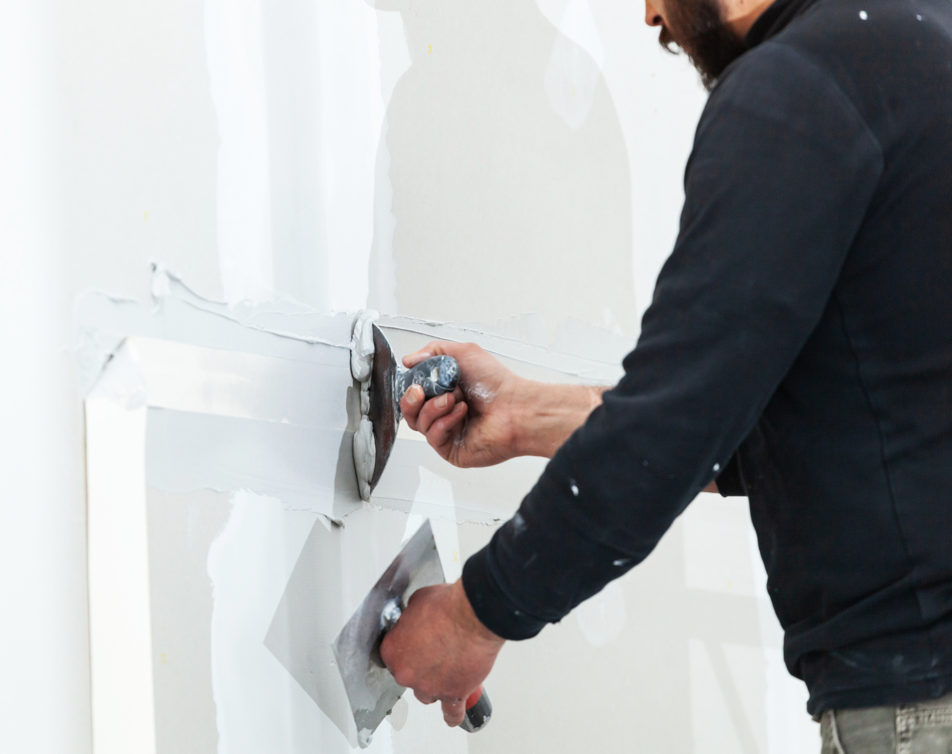 Worker Plastering Gypsum Board Wall